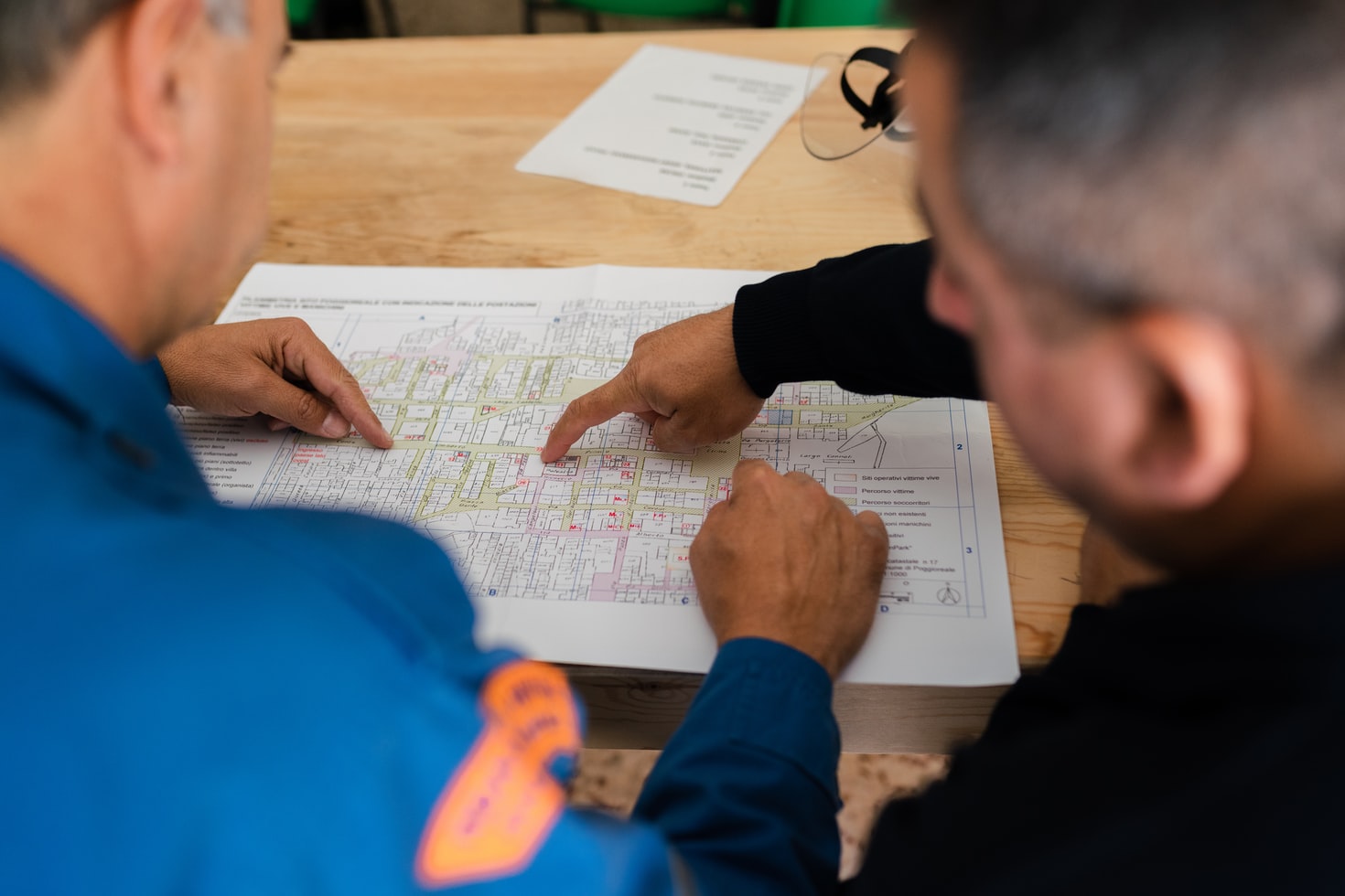 Two men reviewing design plans